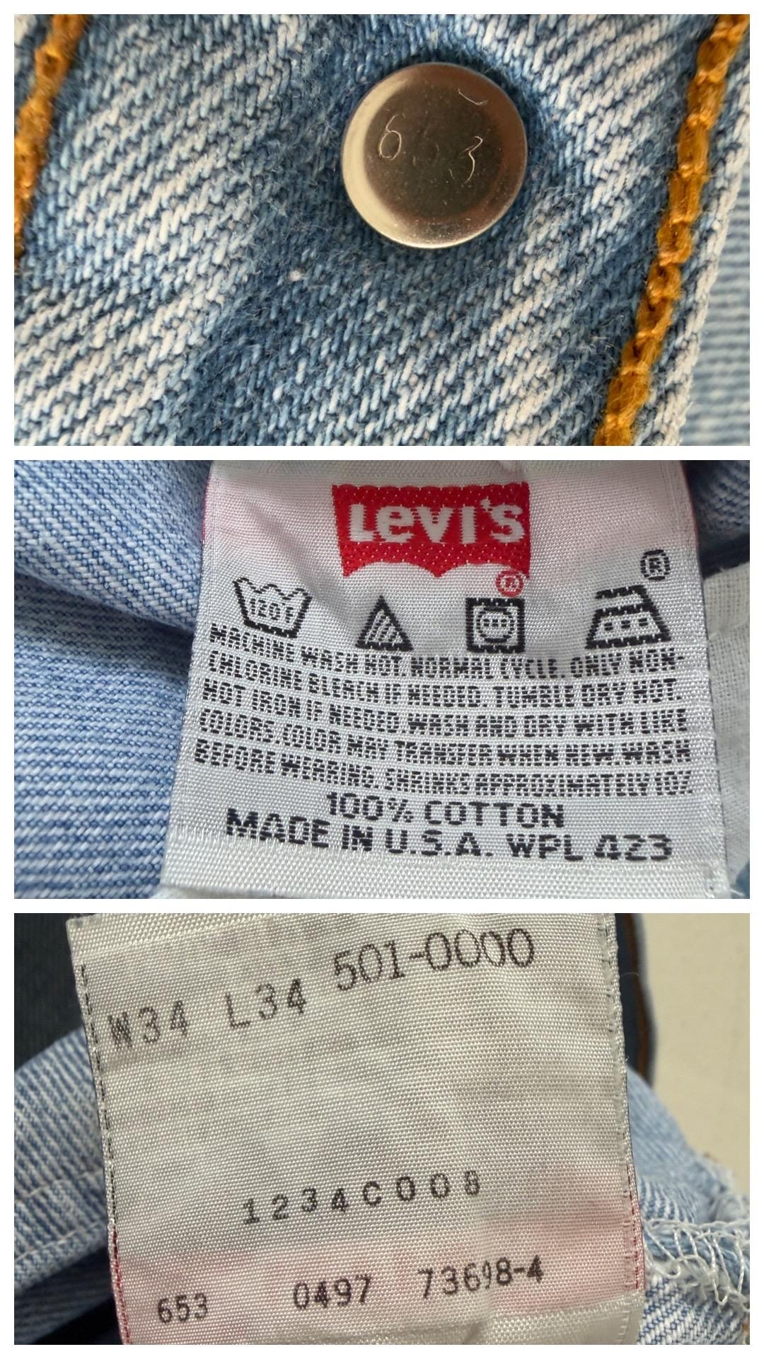 Detailaufnahme des originalen Levi's Care Tags von 1997 (Made in USA, Button Stamp 653, Size W34 L34) und des roten Red Tab Fähnchens.